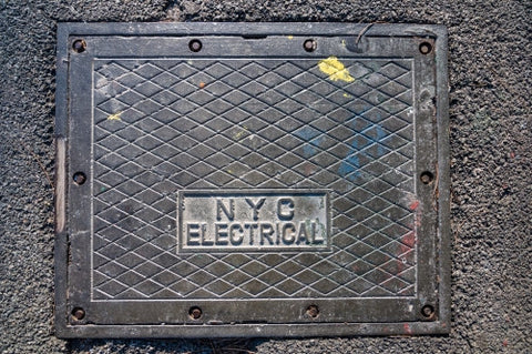 NYC electrical square cover on concrete