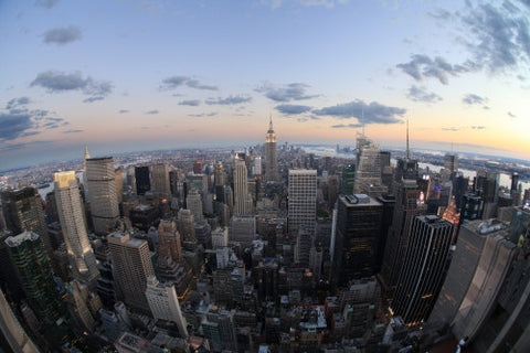 Manhattan cityscape from high aerial view - Empire State Building at sunset - beautiful evening lights in city