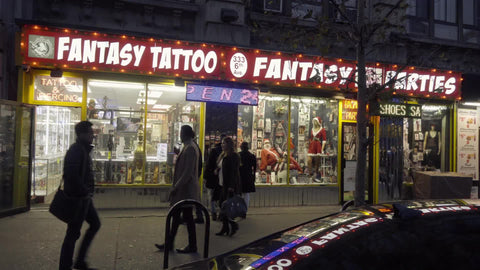 Fantasy Tattoo Party Store at night on 6th Ave in Greenwich Village Manhattan - storefront display