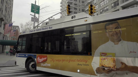 MTA public bus turning corner on 5th ave and 8th street in Manhattan NYC