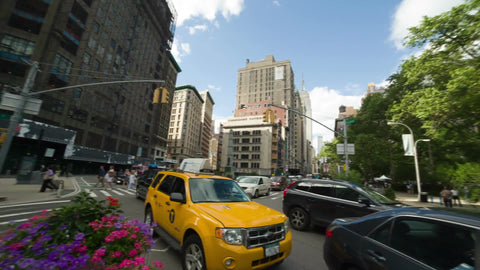 360 degree panoramic view - panning in Madison Square Park with Flatiron Building and skyscrapers on summer day with taxicab