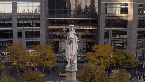 aerial circling controversial Columbus Circle statue in Manhattan New York City NYC