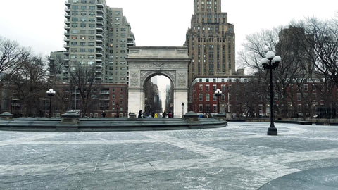 snowing in Washington Square Park cold winter day arch monument NYC
