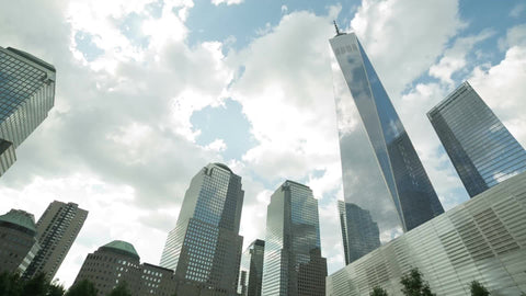 Freedom Tower tilting down to waterfall square in 911 Museum in Downtown Manhattan NYC