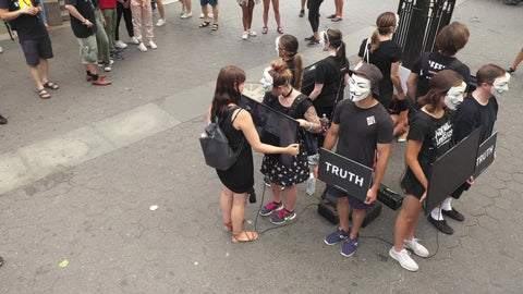 Anonymous Truth protestors demonstrators demonstrating in Union Square Park in New York City NYC