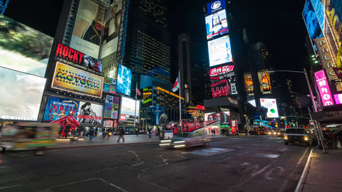 cars speeding by in Times Square at night with billboards and ads - traffic timelapse in 4K Manhattan New York City