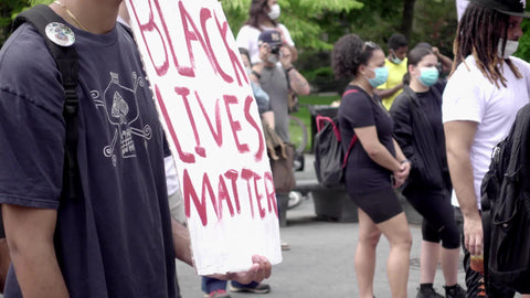 Black Lives Matter sign at BLM protest in park in New York City