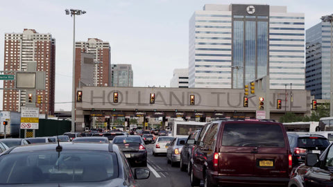 panning across cars in gridlocked traffic - lined up to enter Holland Tunnel