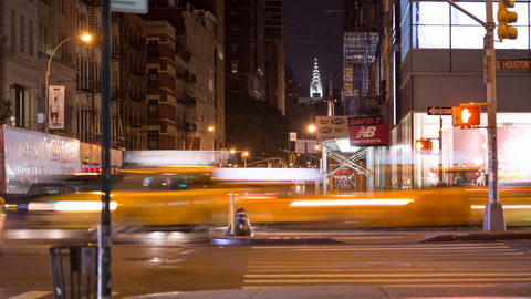 Chrysler Building view from SoHo on busy intersection of Broadway and Houston St in Manhattan - 4k timelapse NYC