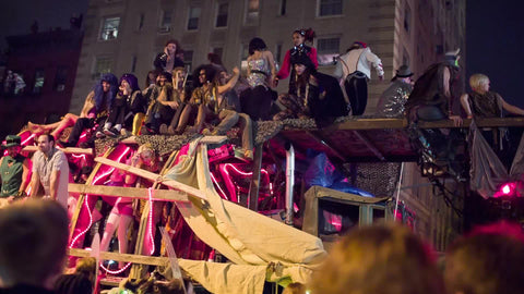 float passing in Halloween parade with people dressed up in costumes in the Village