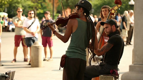 musicians playing violin and cello on summer day in Washington Square Park in NYC