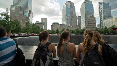 tracking by people at waterfall at Freedom Tower 911 Museum in summer in NYC