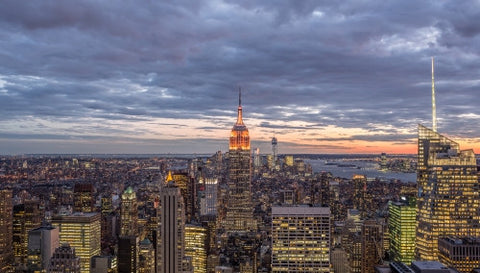 Empire State Building at sunset in early evening - Manhattan cityscape with skyscrapers from high view