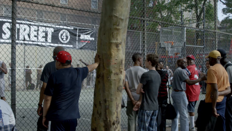 man takes jumpshot at famous West 4th Street basketball courts in slow motion 4K Manhattan NYC