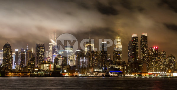 Manhattan skyline on cloudy muggy night with Empire State Building