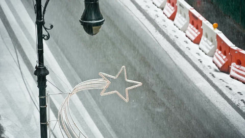 snowing on street with taxi cab driving in storm - seamless loop