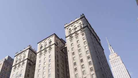 famous Vanderbilt Hotel with Empire State Building in background in Manhattan NYC