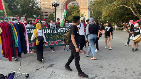 Palestine will be free chant protestors marching with Palestinian flag in Washington Square Park with audio in NYC
