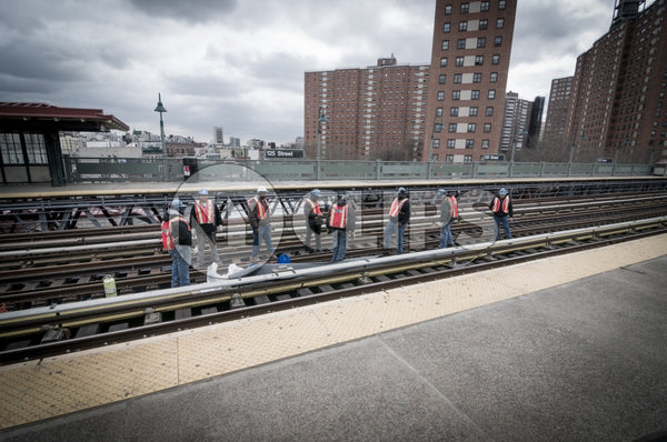 MTA workers on elevated subway station track on 125th Street in Harlem, Uptown Manhattan
