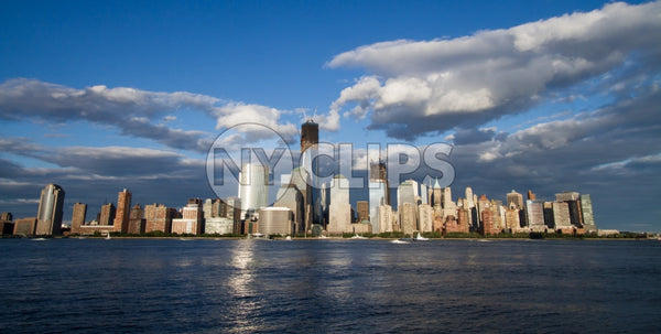 Lower Manhattan skyline with Freedom Tower and skyscrapers on summer day with blue sky