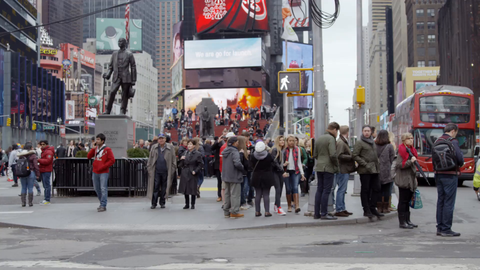 crowded Times Square street corner - tourists in slow motion on busy New York City on cold winter day in 4K