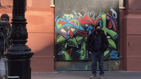 art murals on building paintings on corner Broadway Downtown Manhattan New York City NYC