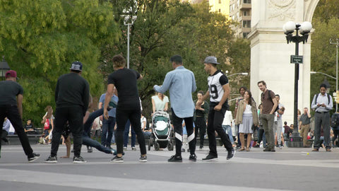 breakdancer in Washington Square Park breakdancing on summer day in NYC