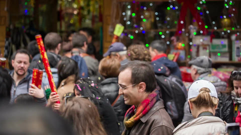 Chinese new year parade with people celebrating with confetti in Chinatown