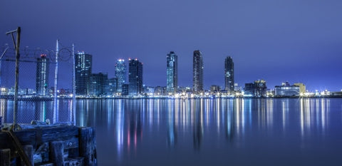 New Jersey skyline view from Westside of Manhattan at night across Hudson River with beautiful reflections in water