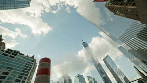 Freedom Tower towering over steaming construction pipe - orange smokestack in Downtown Manhattan in NYC