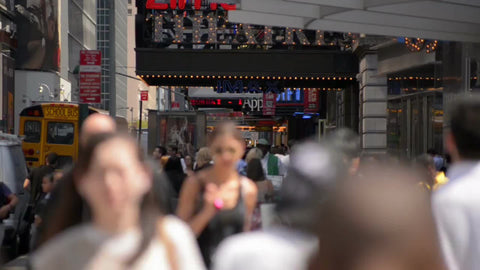crowded Midtown with people walking in slow motion near Times Square on sunny day in 1080 HD NYC