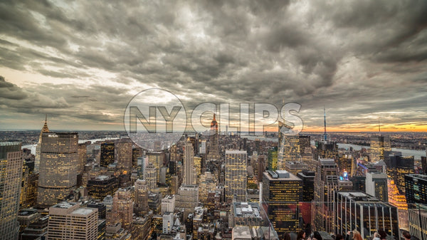 Empire State Building and Manhattan cityscape with beautiful cloud pattern overhead at sunset in early evening
