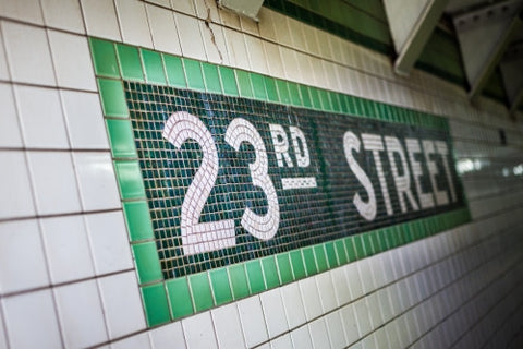 23rd street sign on tile wall in subway station in NYC