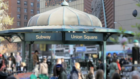 Union Square subway train station sign crowded entrance with people outside