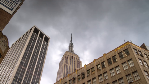 close-up of cloudy sky over Empire State Building - 4K timelapse in Manhattan with clouds in New York City