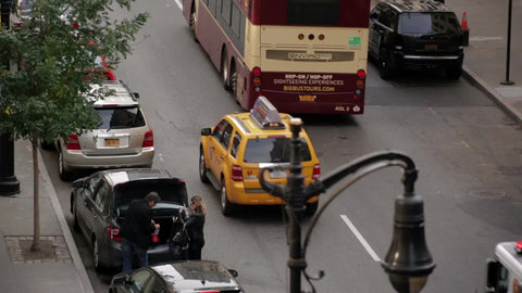 FDNY fire truck honking in traffic - emergency siren and turret lights flashing in NYC