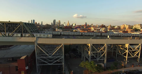 two subway trains crossing paths opposite directions NYC