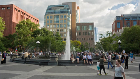 famous fountain in center of Washington Square Park in summer in NYC