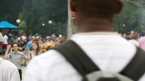 people crossing busy street at Columbus Circle on hot summer day - close up of crowded crosswalk in Manhattan NYC