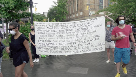 list of names of Black victims of racial profiling abuse murder and police brutality at BLM rally in New York City