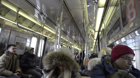 interior subway car - passengers riding B train in winter