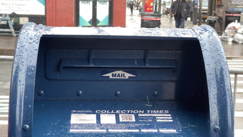 close up mailbox on street snowing in winter Manhattan New York City NYC