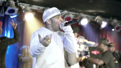 close-up of Prodigy of Mobb Deep rapping on stage at concert - rap show at BB Kings
