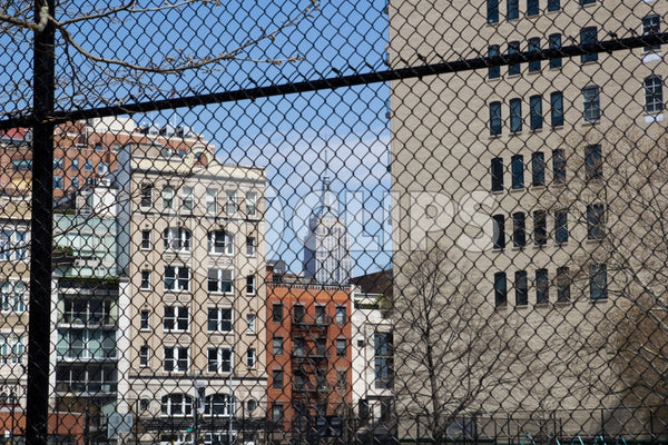 Empire State Building seen through fence