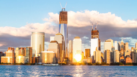 Downtown Manhattan skyline with Freedom Tower under construction - 4K timelapse from day to night in NYC