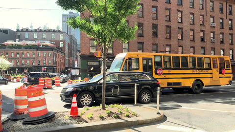 yellow school bus driving in Meatpacking District Manhattan New York City NYC