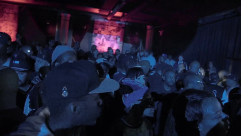 panning by faces in crowd at hip hop show in NYC