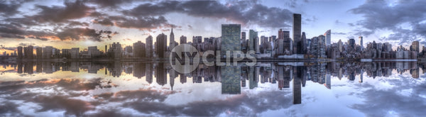 Manhattan skyline Empire State Building, United Nations sunset on East River water with sky and clouds
