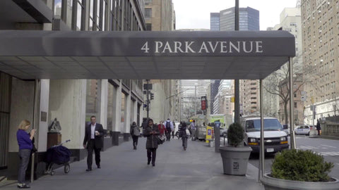4 Park Ave entrance on street, people walking in winter fall or spring with coats in NYC