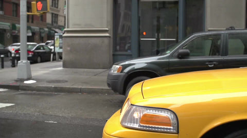 hood of taxicab driving - cab moving past construction site with fiber optic cables in slow motion in Manhattan street in NYC